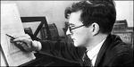 Young Shostakovich (1906-1975) with score at the piano